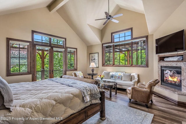 36 Primrose Ln, Carbondale, CO 81623 - bedroom featuring high vaulted ceiling, wood finished floors, a stone fireplace, and beam ceiling