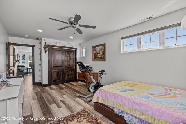 510 S Wildhorse Dr, New Castle, CO 81647 - bedroom featuring recessed lighting, wood finished floors, a closet, and a ceiling fan