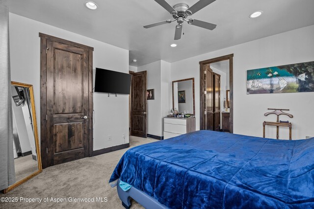 510 S Wildhorse Dr, New Castle, CO 81647 - bedroom with light carpet, recessed lighting, connected bathroom, baseboards, and a ceiling fan