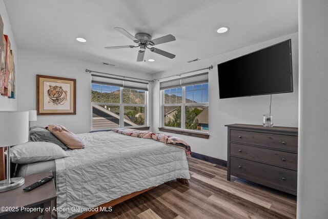 510 S Wildhorse Dr, New Castle, CO 81647 - bedroom with recessed lighting, wood finished floors, baseboards, and a ceiling fan