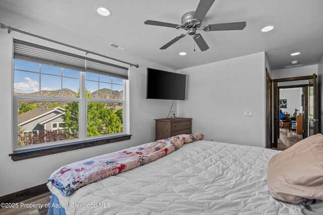 510 S Wildhorse Dr, New Castle, CO 81647 - bedroom with recessed lighting, wood finished floors, a ceiling fan, and baseboards