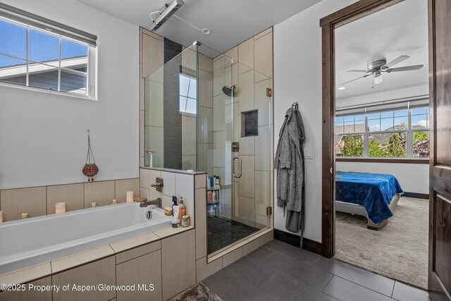510 S Wildhorse Dr, New Castle, CO 81647 - full bathroom featuring tile patterned floors, ensuite bathroom, a garden tub, a stall shower, and ceiling fan