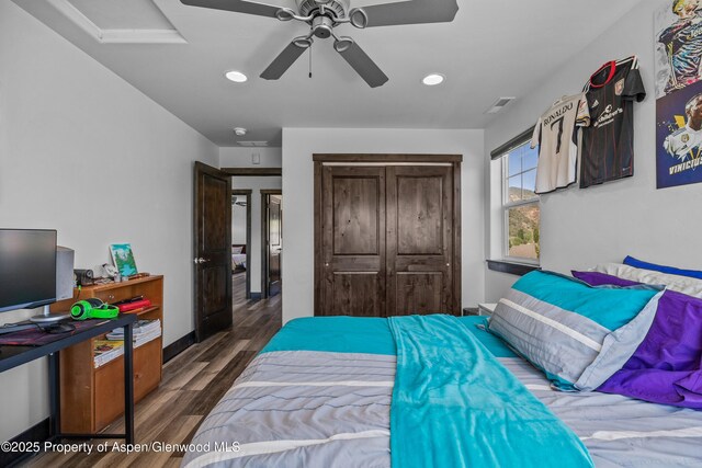 510 S Wildhorse Dr, New Castle, CO 81647 - bedroom featuring recessed lighting, wood finished floors, a closet, a ceiling fan, and baseboards