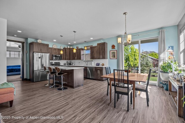 510 S Wildhorse Dr, New Castle, CO 81647 - dining area with dark wood-style floors, a chandelier, and recessed lighting
