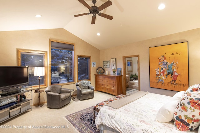 bedroom with ceiling fan, light colored carpet, and vaulted ceiling