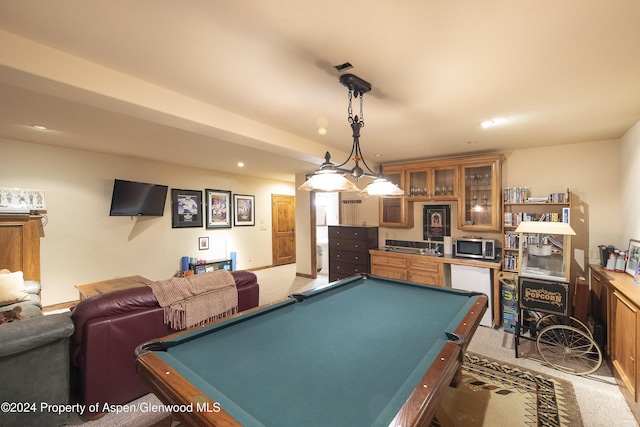 game room with bar area, light carpet, and pool table