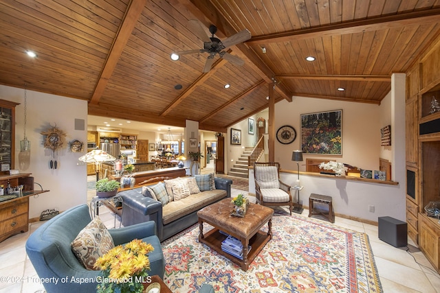 living room featuring lofted ceiling with beams, light tile patterned floors, wood ceiling, and ceiling fan