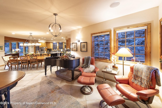 sitting room with light tile patterned floors and a chandelier