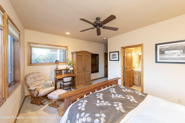 bedroom featuring ceiling fan and ensuite bath