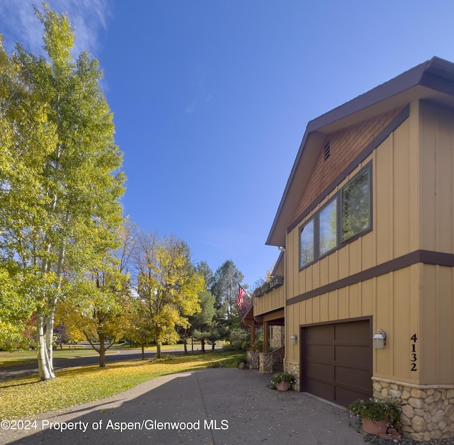 view of side of property featuring a garage