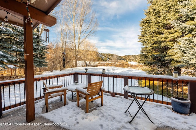 view of snow covered deck