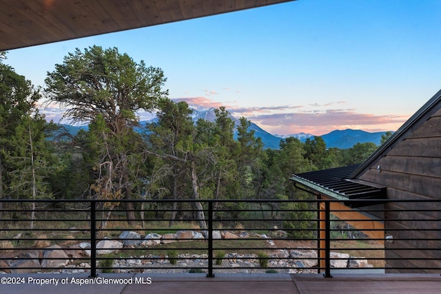 balcony at dusk with a mountain view