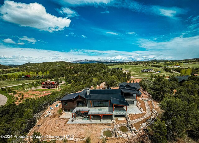 drone / aerial view featuring a mountain view