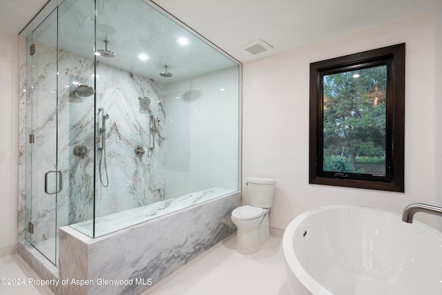 full bathroom featuring toilet, sink, and shower with separate bathtub