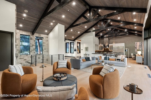 living room with beamed ceiling, light hardwood / wood-style flooring, high vaulted ceiling, and wooden ceiling