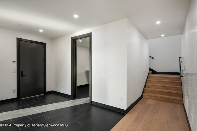 hall featuring dark wood-type flooring