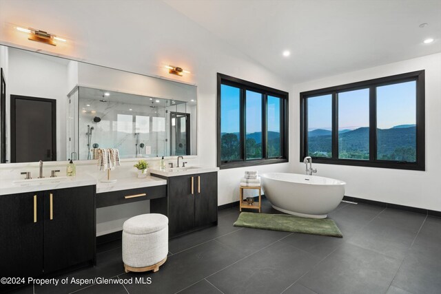 bathroom with vanity, separate shower and tub, a mountain view, tile patterned flooring, and lofted ceiling