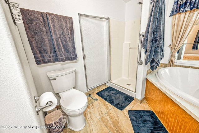 bathroom with toilet, tile patterned flooring, and separate shower and tub