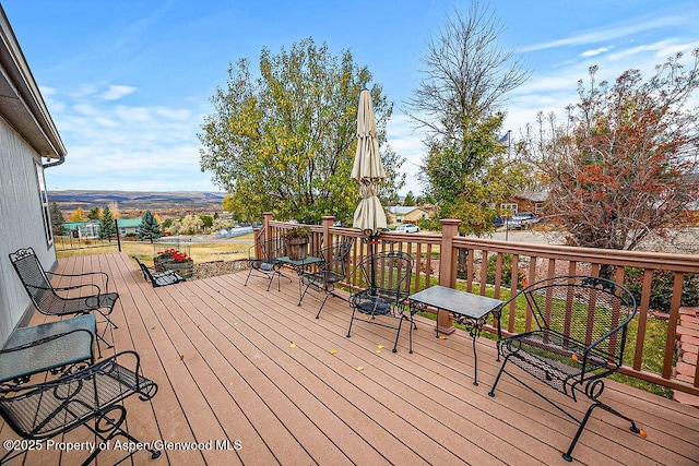 wooden terrace with a mountain view