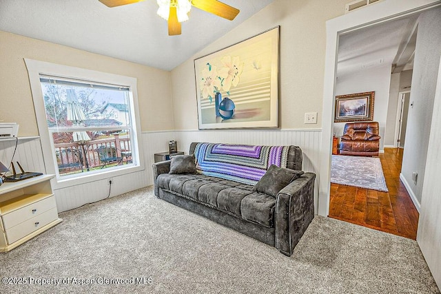 living room featuring lofted ceiling, ceiling fan, and hardwood / wood-style floors