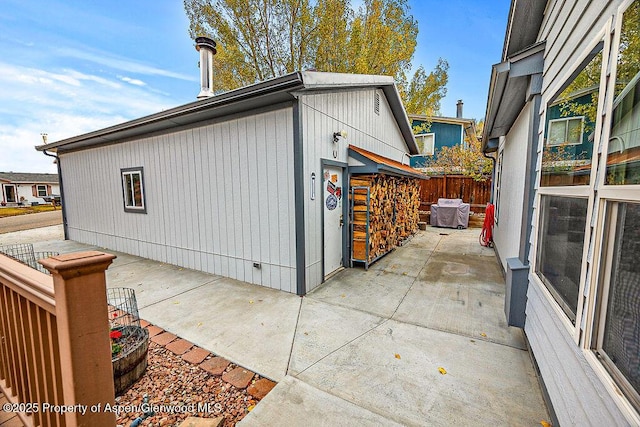 view of side of property with a patio area