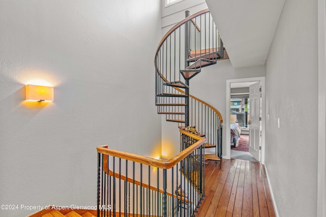 115 Harleston Grn Unit 63, Snowmass Village, CO 81615 - stairway with baseboards and hardwood / wood-style floors