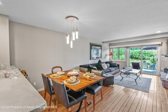 dining area with light hardwood / wood-style floors