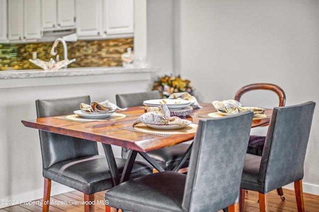 115 Harleston Grn Unit 63, Snowmass Village, CO 81615 - dining room featuring wood finished floors