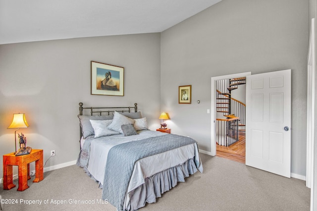 carpeted bedroom featuring vaulted ceiling