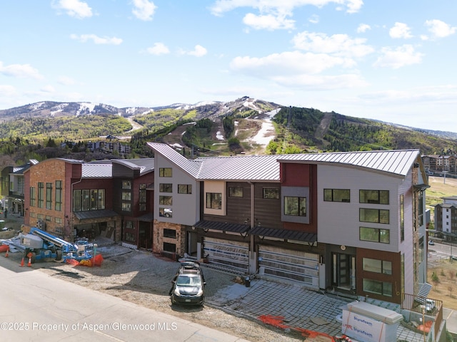 1855 Burgess Creek Rd Unit # 3 & 4, Steamboat, CO 80487 - view of front of home featuring a standing seam roof, a mountain view, metal roof, and stone siding