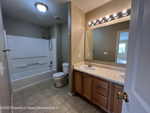 full bathroom featuring shower / bathing tub combination, vanity, and toilet