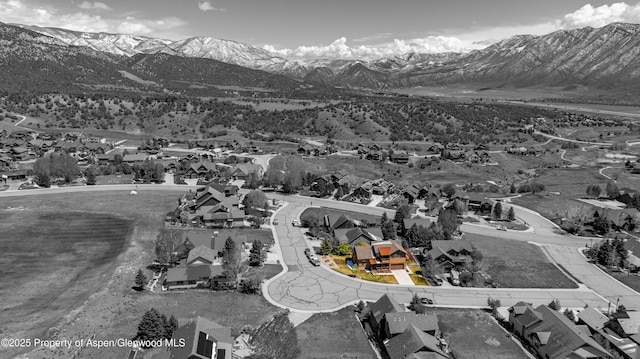aerial perspective of suburban area featuring a mountainous background