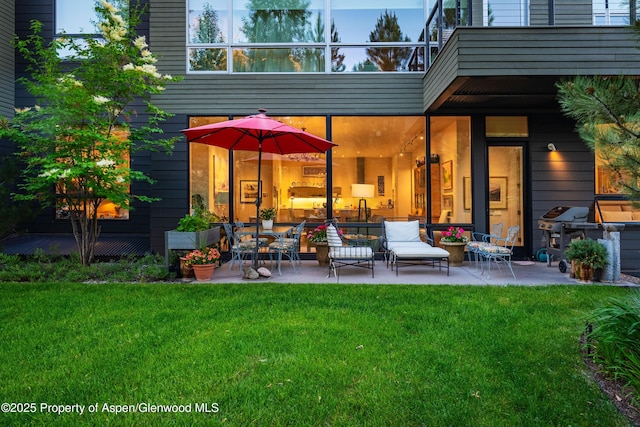 102 Evans Rd Unit 104, Basalt, CO 81621 - back of property with a patio and a lawn