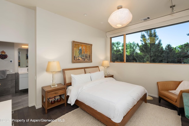 102 Evans Rd Unit 104, Basalt, CO 81621 - bedroom with dark wood-style floors and baseboards
