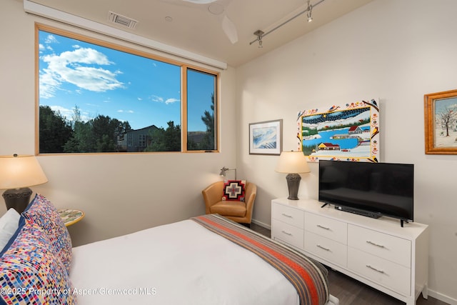 102 Evans Rd Unit 104, Basalt, CO 81621 - bedroom with rail lighting and wood finished floors