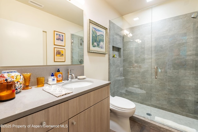 102 Evans Rd Unit 104, Basalt, CO 81621 - bathroom with vanity, a shower stall, and wood finished floors