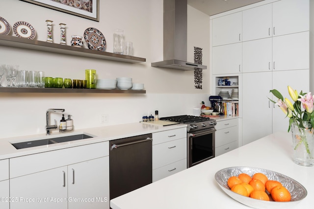 102 Evans Rd Unit 104, Basalt, CO 81621 - kitchen with wall chimney exhaust hood, stainless steel appliances, open shelves, light countertops, and white cabinets