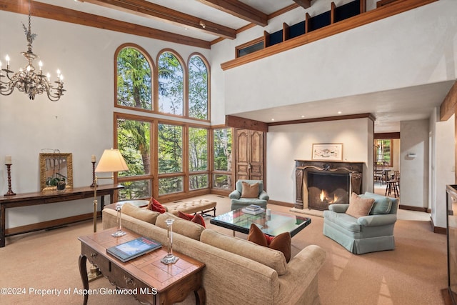 living room featuring beam ceiling, an inviting chandelier, a high end fireplace, a towering ceiling, and light carpet