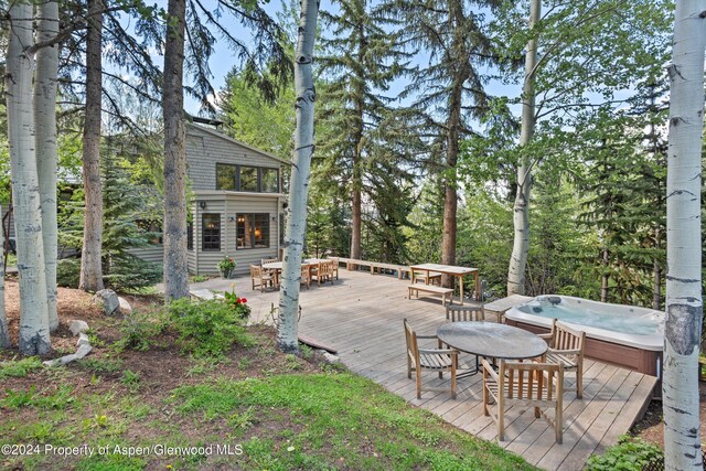 deck featuring a hot tub