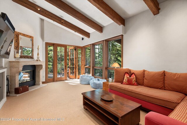 living room with beam ceiling, light carpet, high vaulted ceiling, and french doors