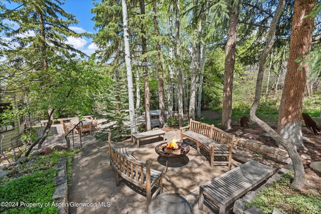 view of patio featuring an outdoor fire pit