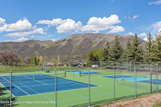 view of sport court with a mountain view