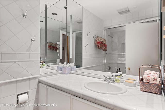 bathroom featuring vanity and walk in shower