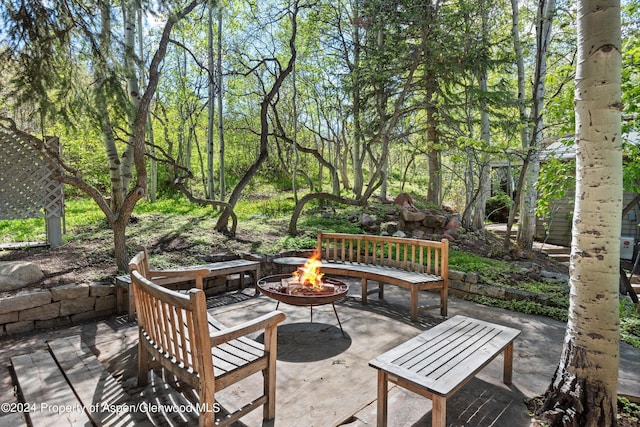 view of patio / terrace featuring a fire pit