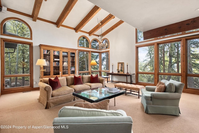 living room featuring plenty of natural light, light carpet, and high vaulted ceiling