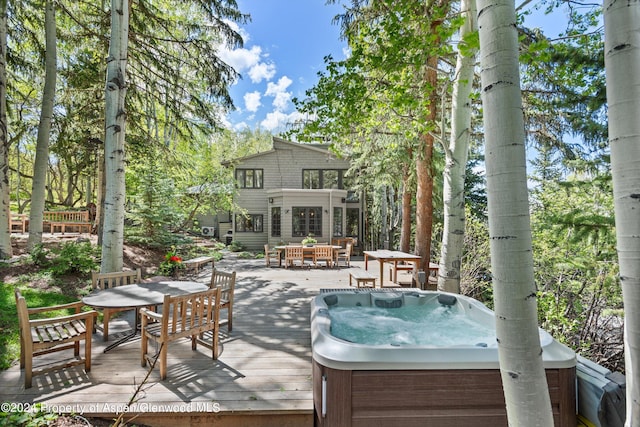 view of patio with a wooden deck, area for grilling, and a hot tub