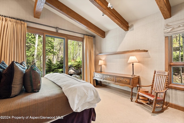 carpeted bedroom with vaulted ceiling with beams