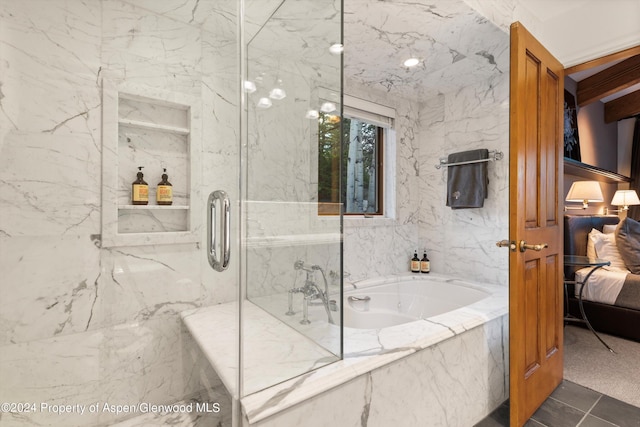 bathroom featuring tile patterned floors and independent shower and bath