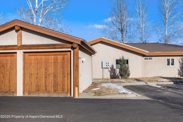 view of side of property featuring a garage