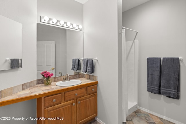 bathroom with vanity and walk in shower